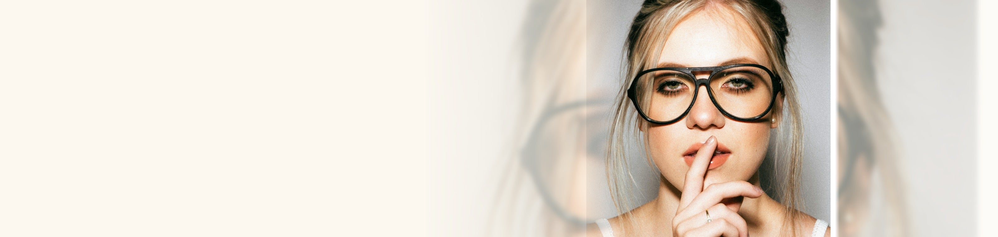 Eyeglass frames styled on a warm beauty table